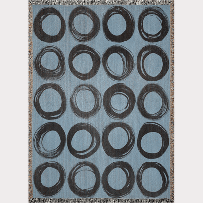 Black Ink-Painted Circles on Blue Woven Blanket