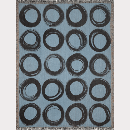 Black Ink-Painted Circles on Blue Woven Blanket