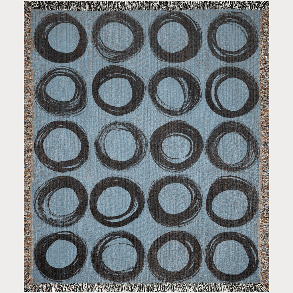 Black Ink-Painted Circles on Blue Woven Blanket